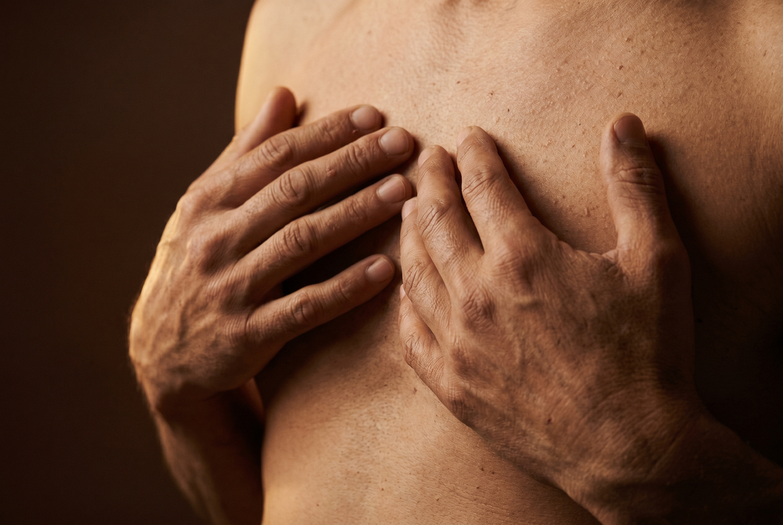 A hand placed gently on the chest — the daily ritual